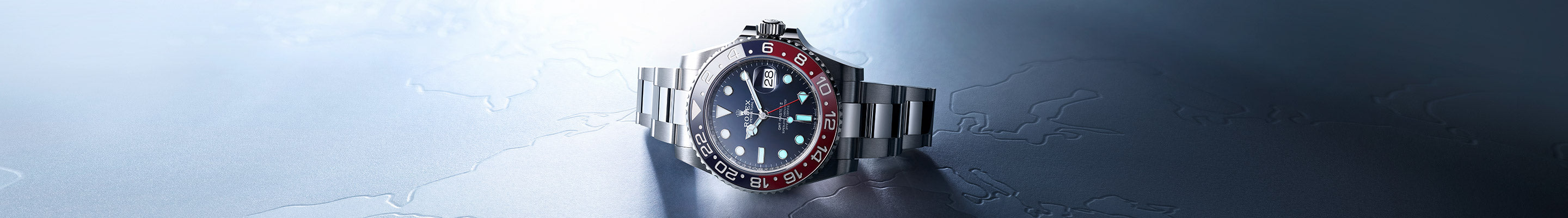 Rolex Oyster Perpetual GMT-Master II on Textured Table at Fink's Jewelers