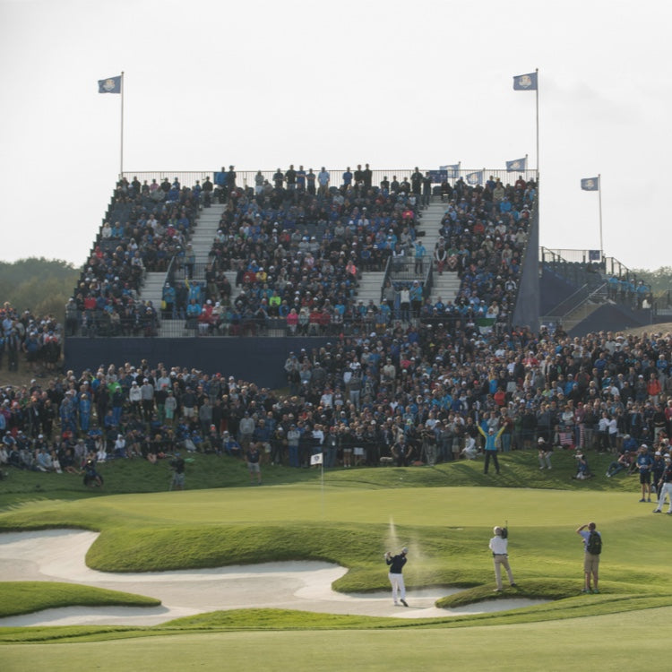 Spectators Watch a Golfer During the Ryder Cup