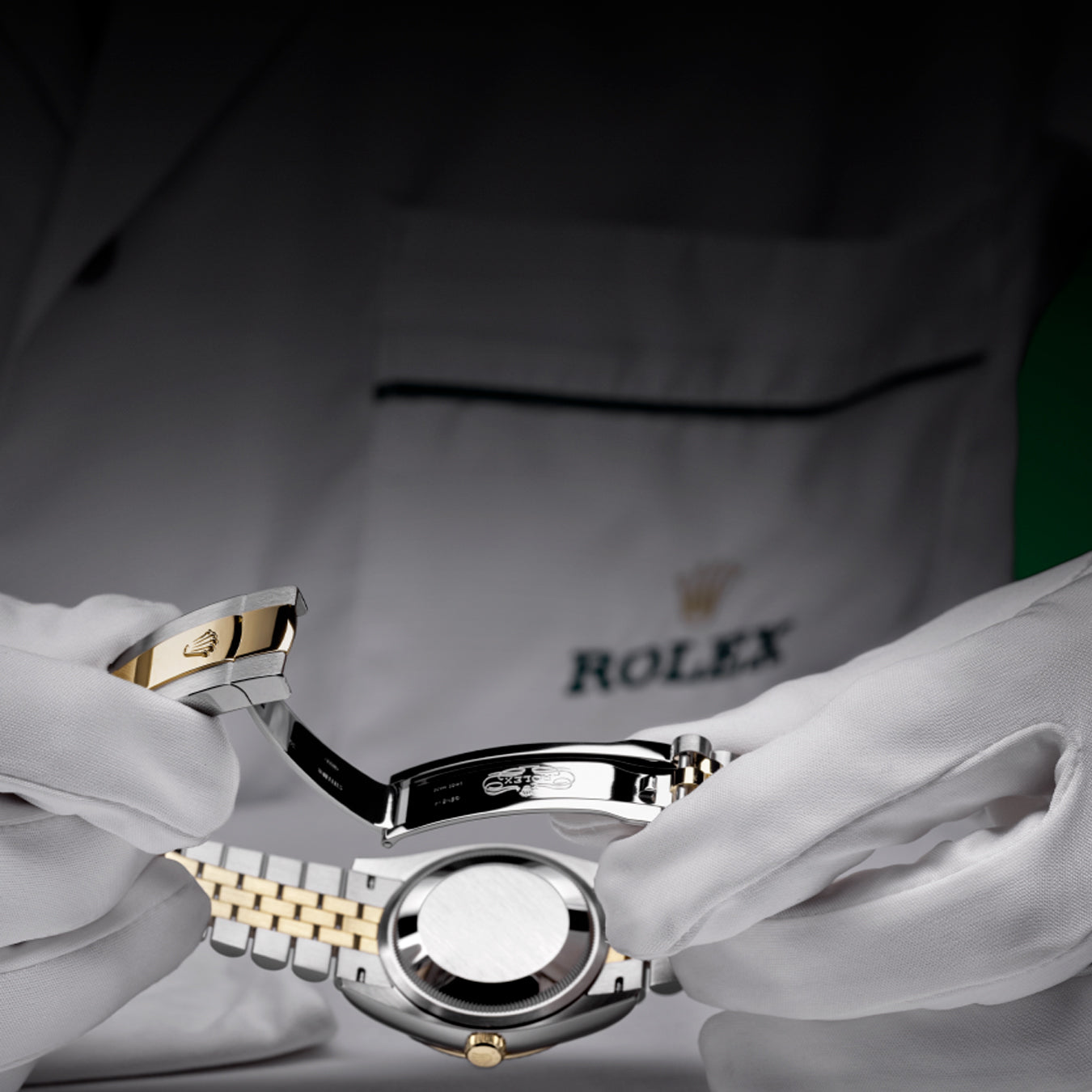 Rolex Watchmaker Holding Watch with Clasp Open