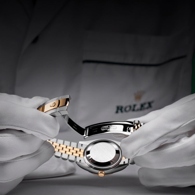 Rolex Watchmaker Inspecting Watch Clasp