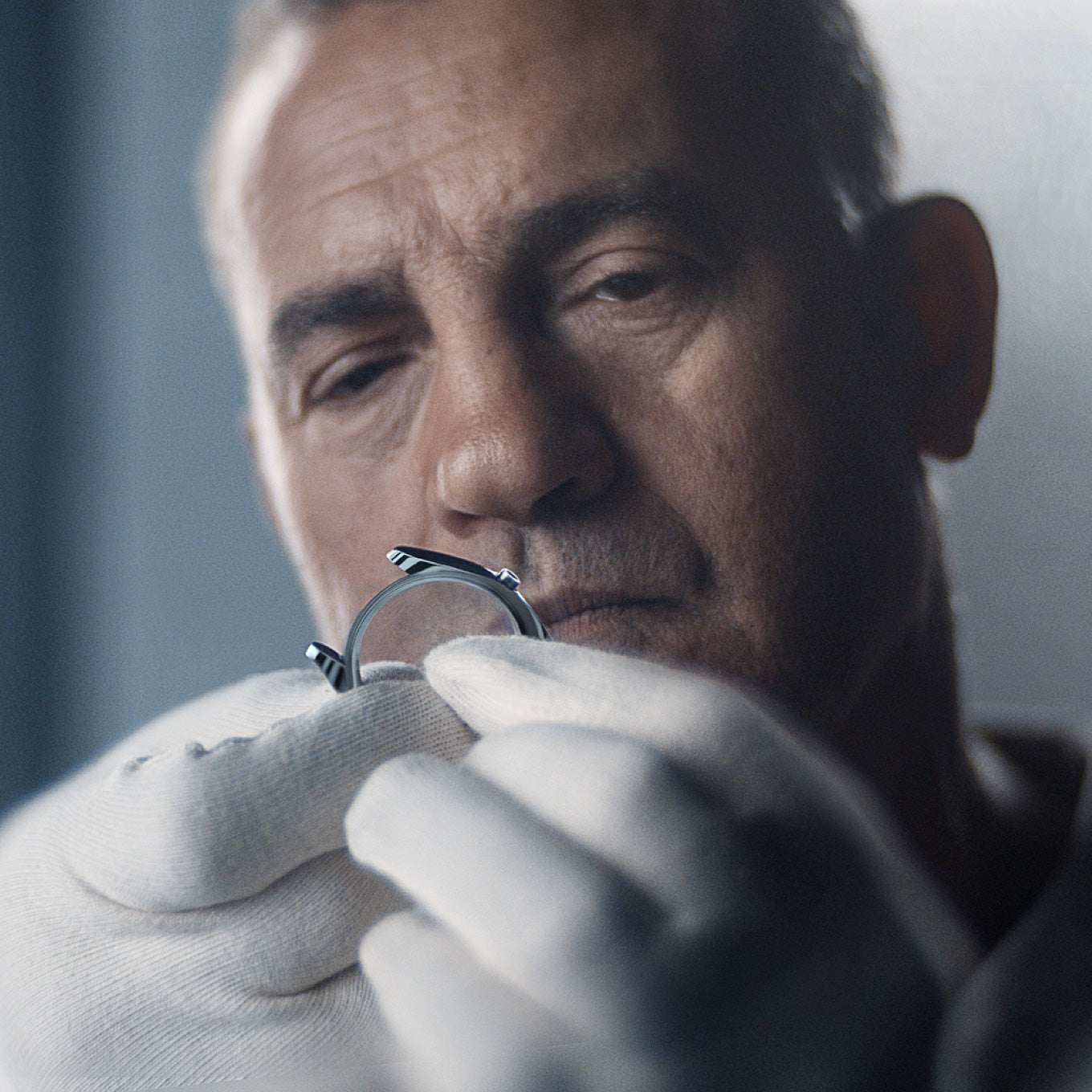 Watchmaker Inspecting Rolex Watch Case