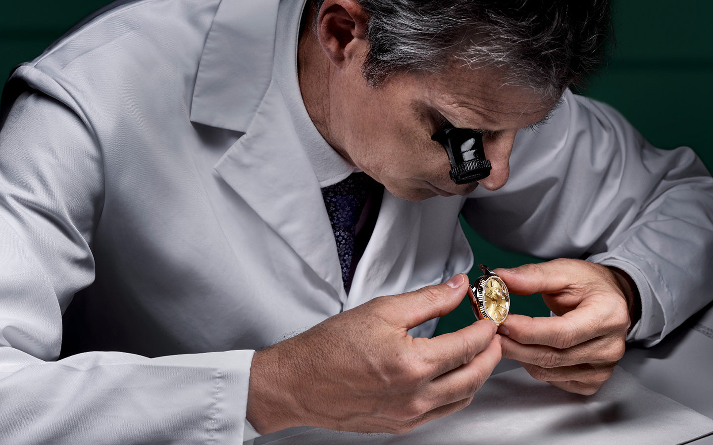 Jeweler Verifying Authenticity During Rolex Servicing at Fink's Jewelers