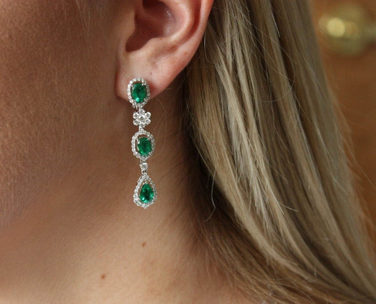 Woman wearing emerald heirloom earrings