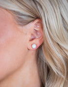Woman Wearing Opal Gemstone Earrings