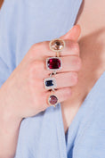 Woman Wearing a Gemstone Ring on Each Finger