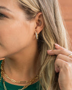 Woman wearings classic huggie earring style