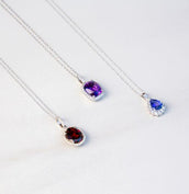 Three pendant necklaces with gemstones and diamonds