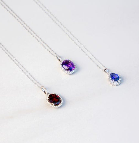 Three pendant necklaces with gemstones and diamonds
