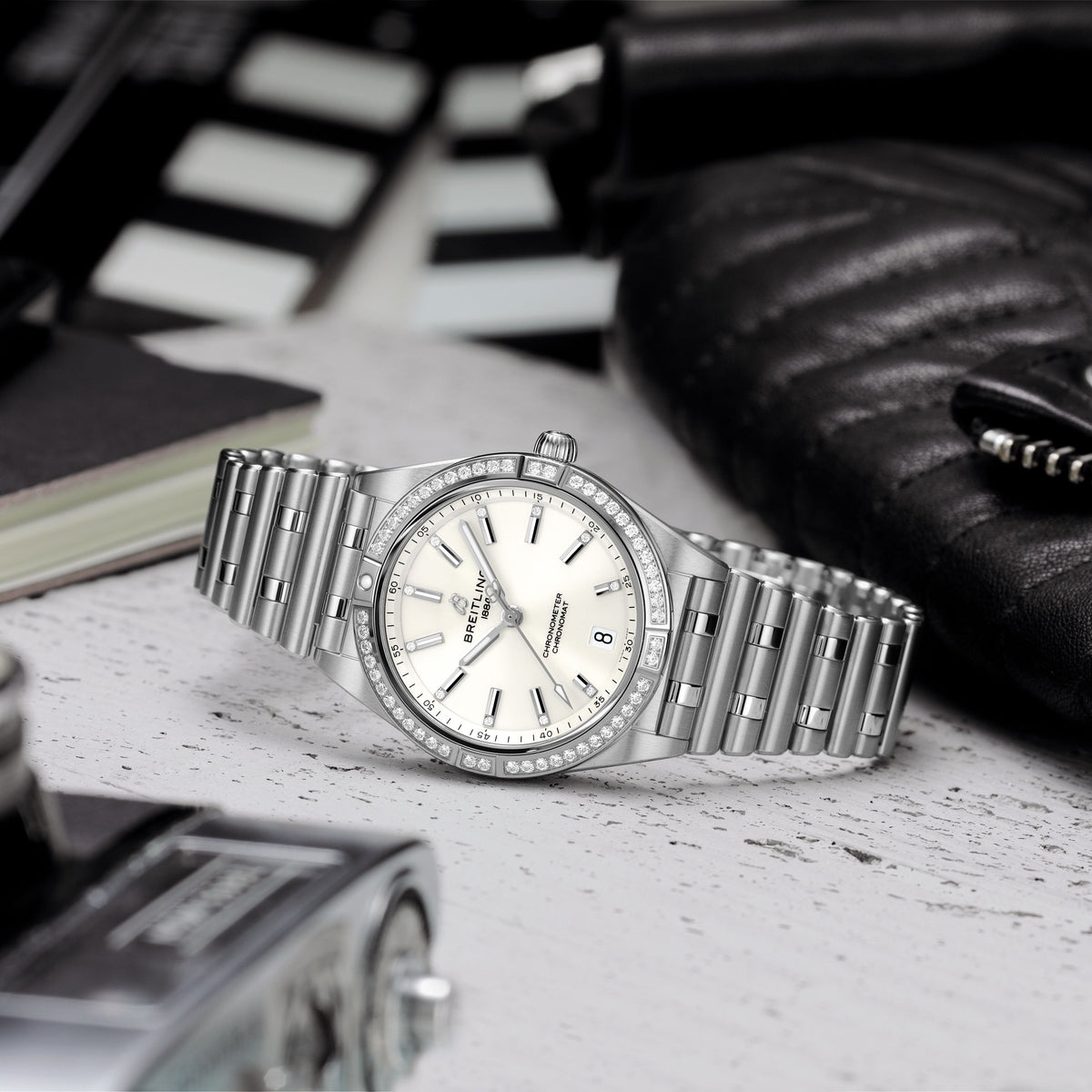 Breitling watch with diamonds on table