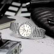Breitling watch on table
