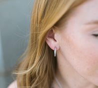 Woman Wearing Small Pair of Diamond Hoop Earrings