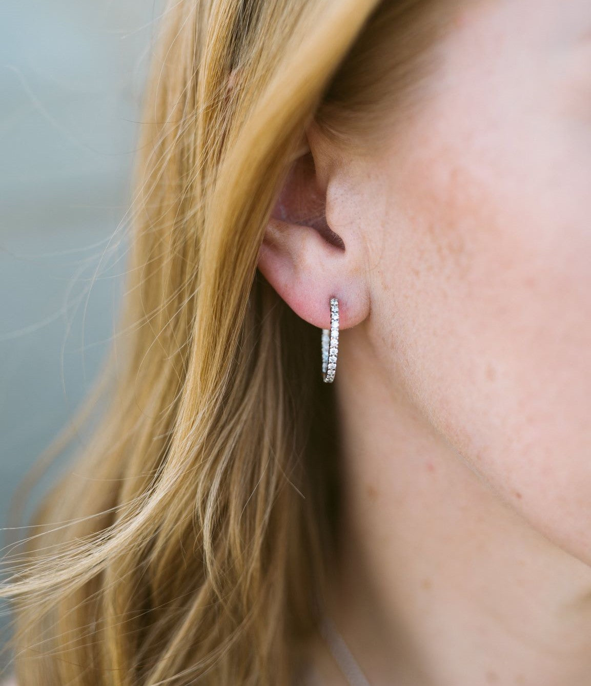 Woman Wearing Diamond Hoop Earring