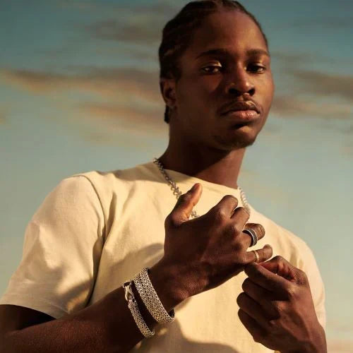 Man modeling Men's bracelets, rings, and necklace from Fink's Jewelers