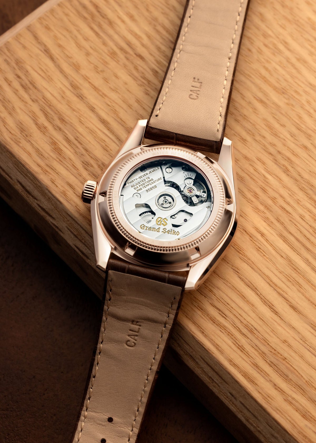 Transparent caseback of Grand Seiko watch with calf leather strap