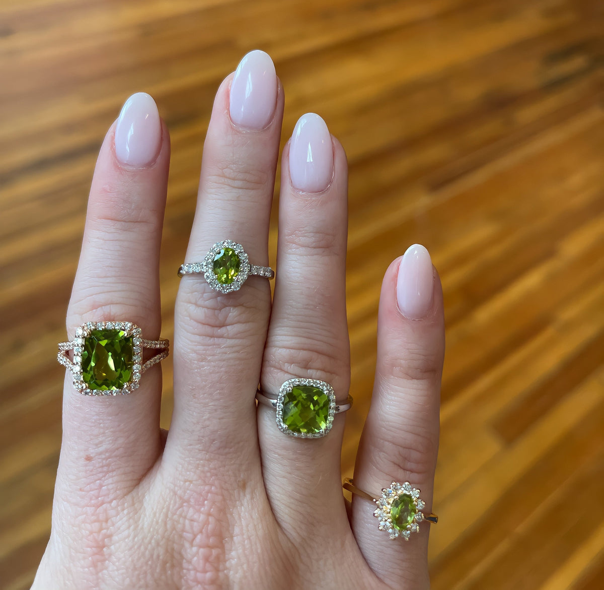Model Wearing Peridot Rings from Fink's Jewelers