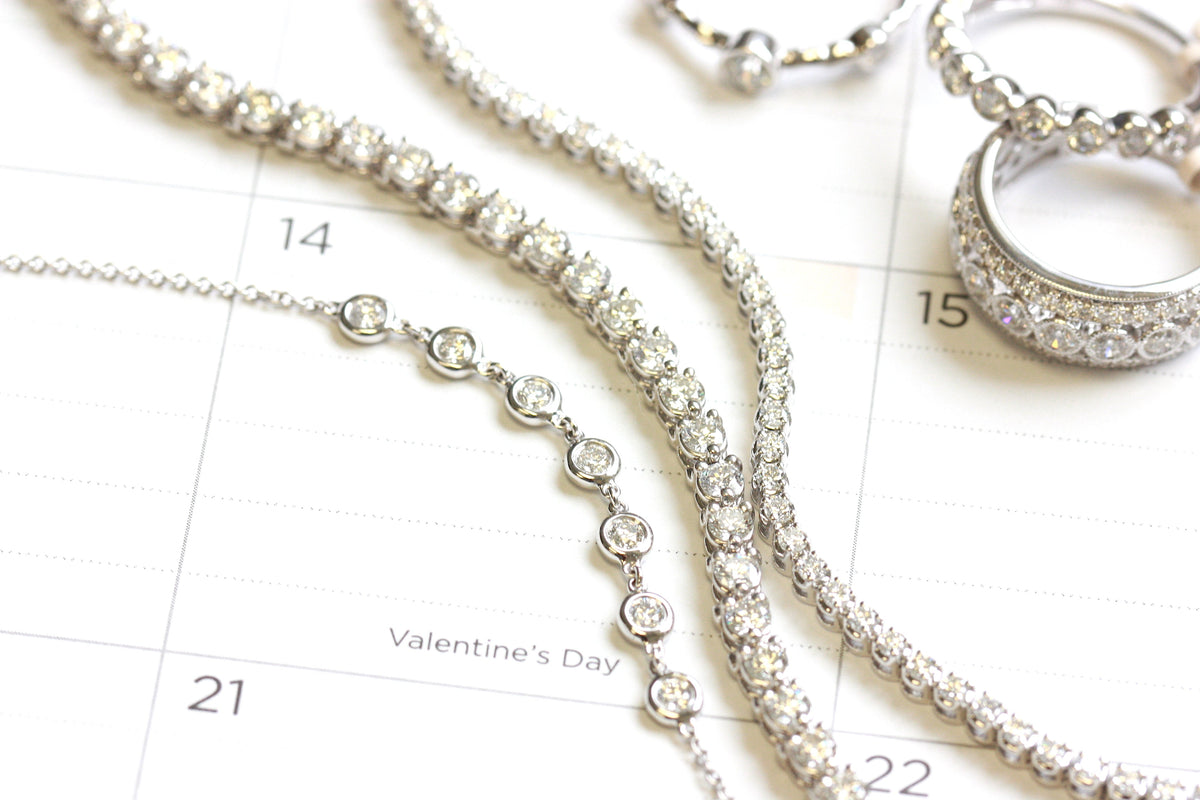 Valentine's Day Diamond Jewelry gifts spread over a calendar