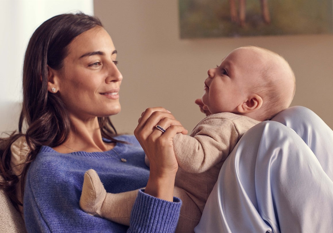 Mother Playing with Baby in Her Lap