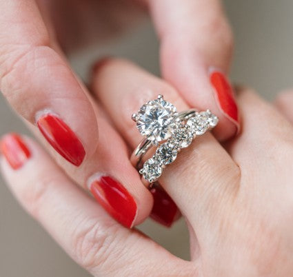 Round diamond engagement ring with round diamond wedding band from Fink's Jewelers