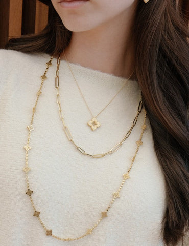 Layered yellow gold necklaces at Fink's Jewelers