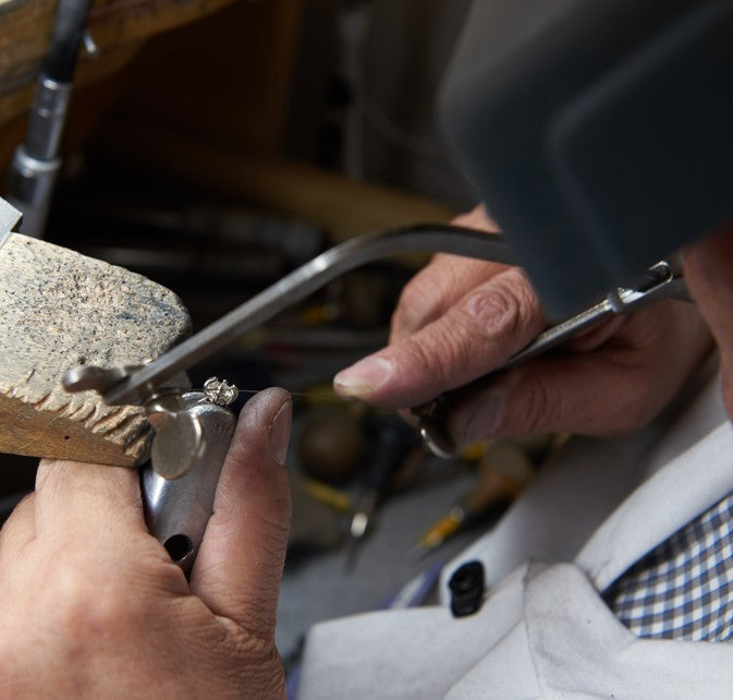 Jeweler creating a custom engagement ring at Fink's Jewelers
