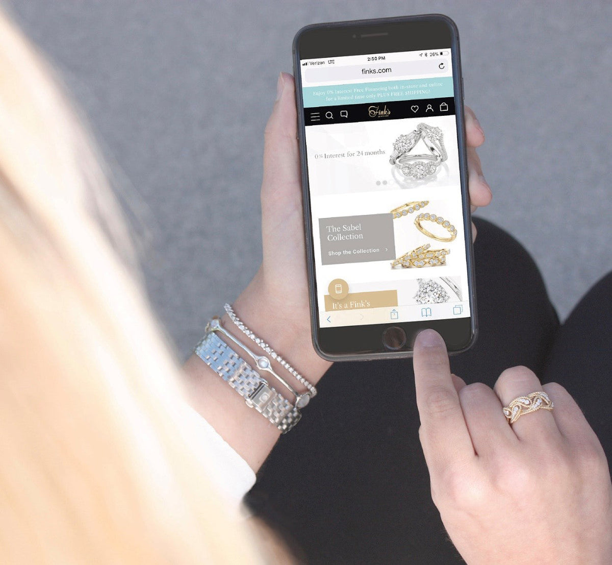 Woman shopping online for jewelry on finks.com