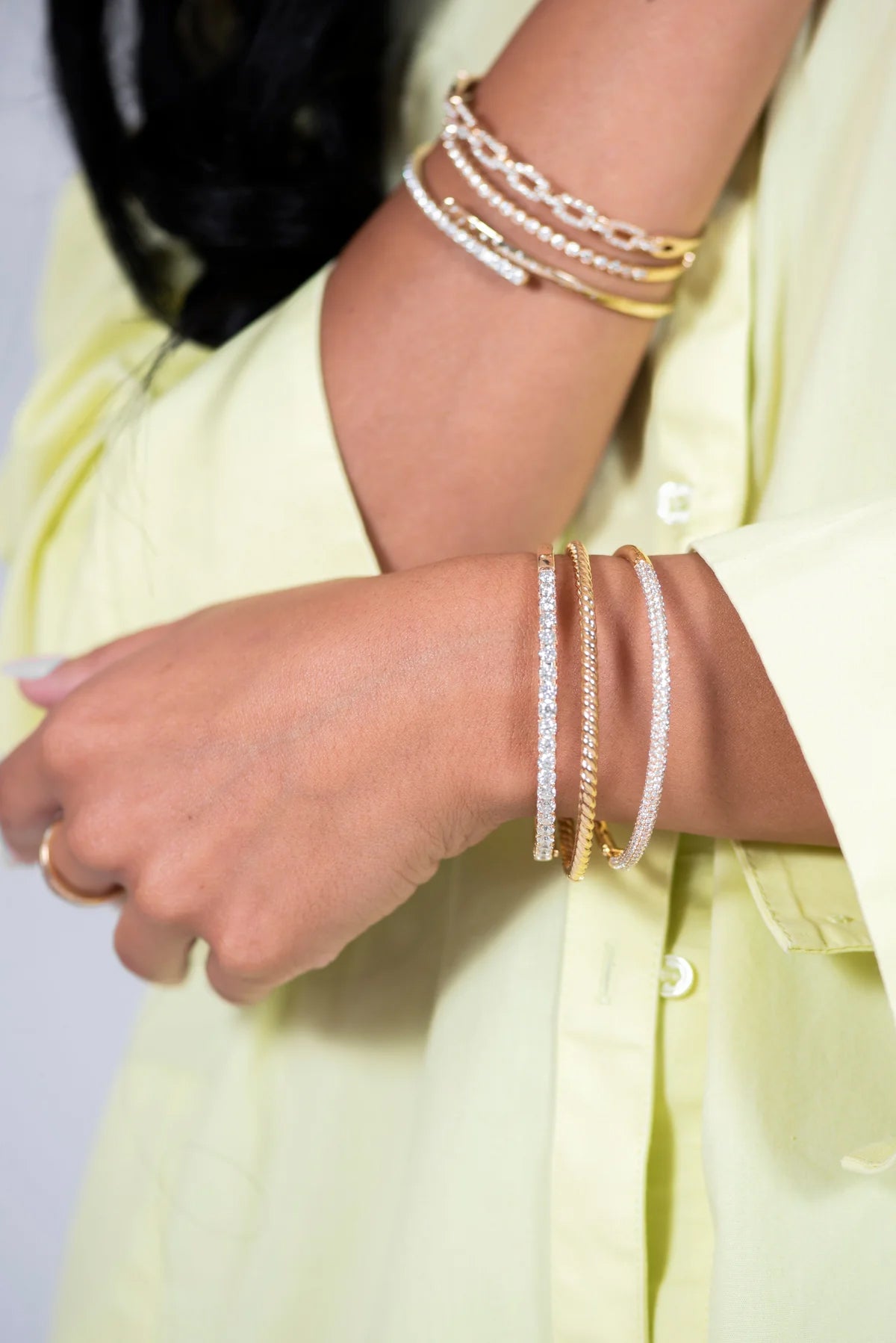 Woman wearing stacking bracelets