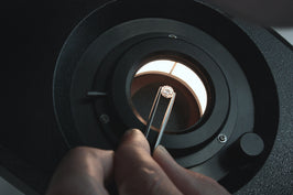 Jeweler Hand-Inspecting Diamond at Fink's Jewelers