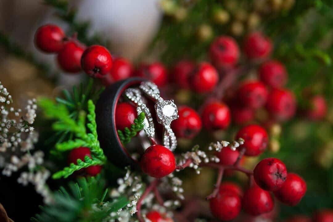 Diamond engagement ring and matching wedding band in Christmas bouquet