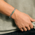 Man wearing John Hardy Icon Sterling Silver Bracelet with Emerald gemstones