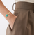 Woman wearing Marco Bicego Lunaria Yellow Gold Turquoise Station Bracelet