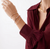 Woman wearing three Marco Bicego Marrakech Twisted Coil Bangles with Diamonds