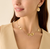 Marco Bicego Lunaria Yellow Gold Small Petal Station Necklace on model