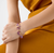 Woman wearing Marco Bicego Paradise Double Strand Amethyst and Pink Tourmaline Bracelet