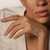 Woman Wearing John Hardy Naga Yellow Gold, Diamond, and Blue Sapphire Dragon Ring