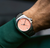 Model Wearing Oris Propilot x Calibre 400 Watch with Salmon Dial