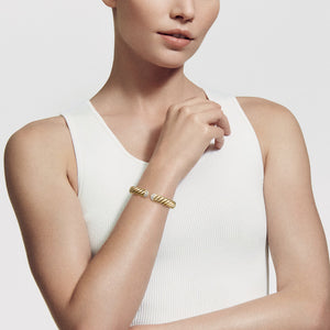 Model Wearing David Yurman Sculpted Cable Cuff Bracelet in 18K Yellow Gold with Diamonds