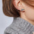 Load image into Gallery viewer, John Hardy Legends Naga Sterling Silver Stud Earrings with Blue Sapphire Eyes