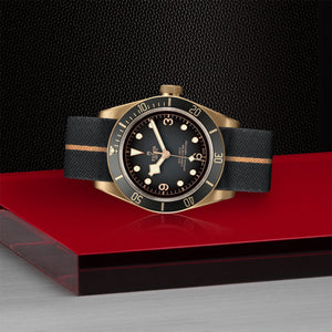 TUDOR Black Bay Bronze Watch Laying Down - M79250ba-0002 at Fink's Jewelers